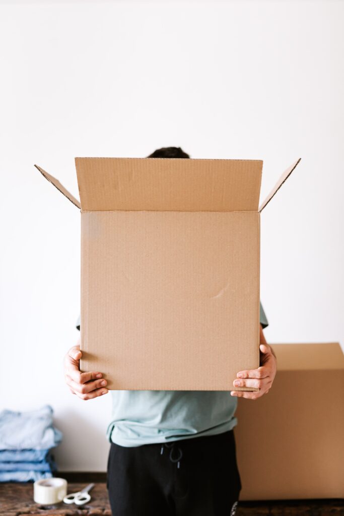 person holding a carton box